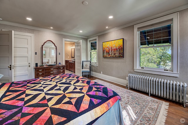 bedroom featuring ornamental molding, dark hardwood / wood-style flooring, ensuite bathroom, and radiator heating unit