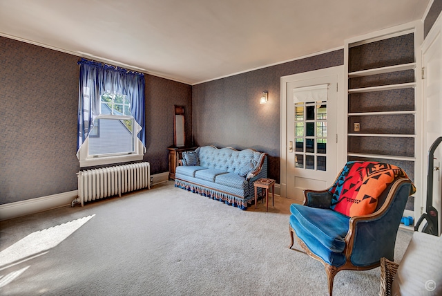 carpeted living room with radiator and built in features