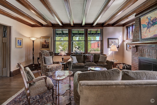 living room with wood-type flooring, crown molding, and a fireplace