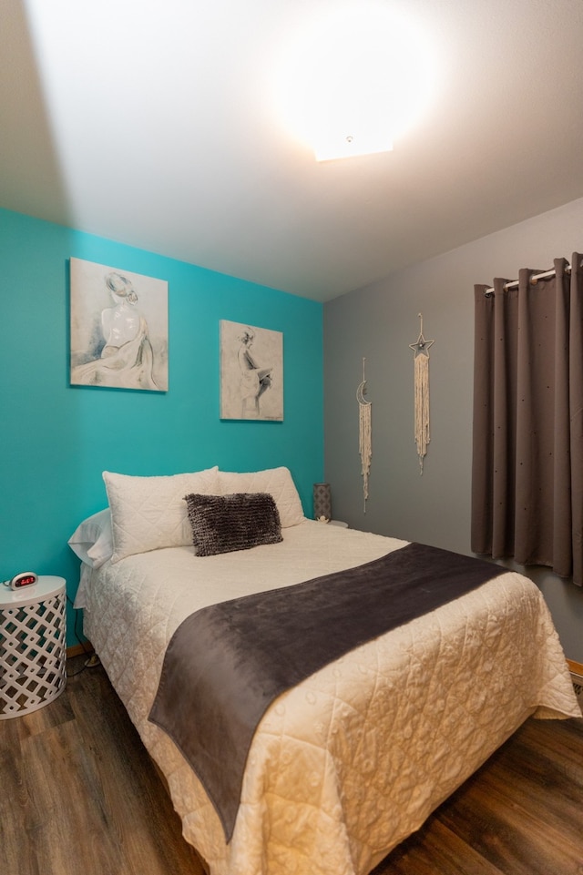 bedroom featuring dark wood-type flooring