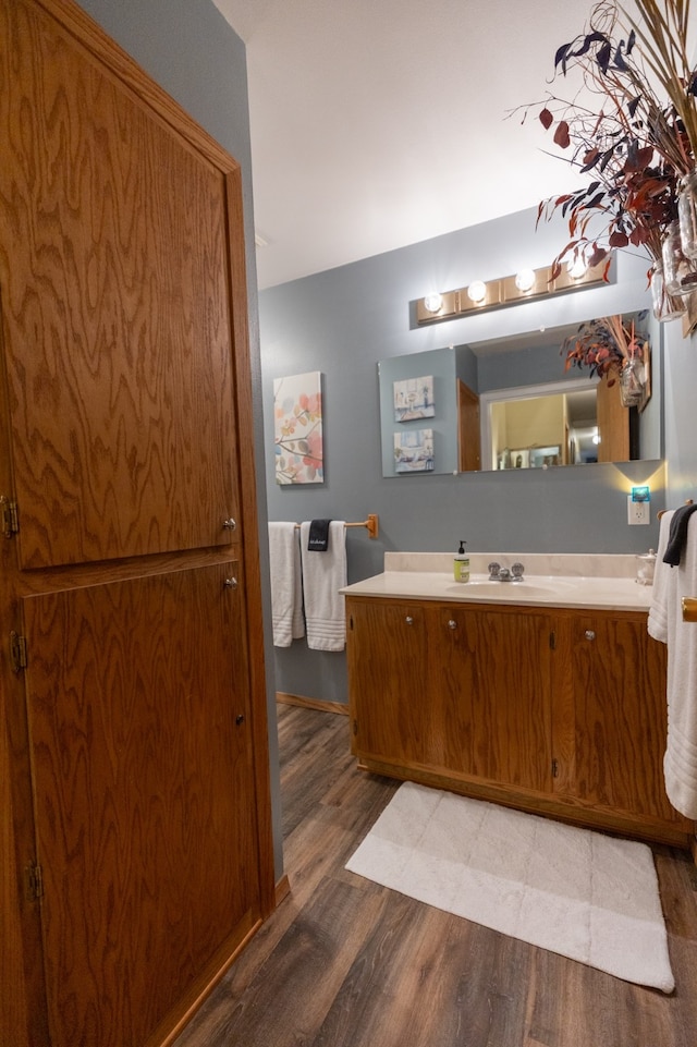 bathroom featuring vanity and wood-type flooring