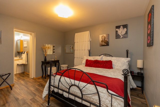 bedroom with dark hardwood / wood-style flooring