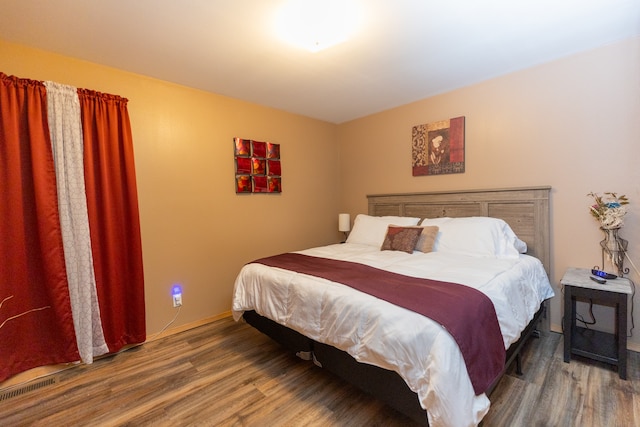 bedroom featuring dark hardwood / wood-style floors