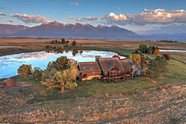 birds eye view of property featuring a mountain view and a rural view