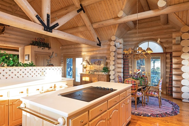 kitchen with light wood-type flooring, rustic walls, black electric stovetop, and wooden ceiling