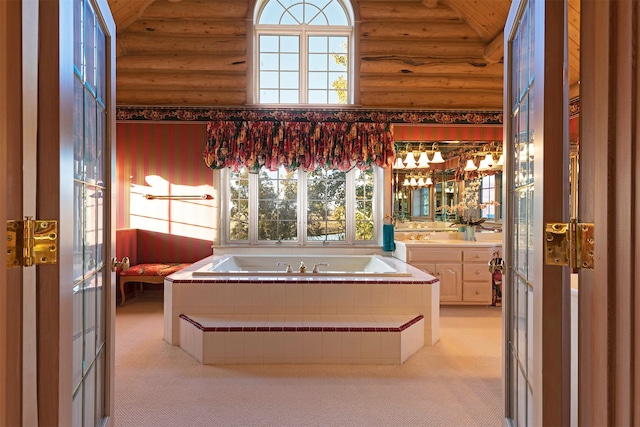 bathroom with log walls, a bath, lofted ceiling, and a wealth of natural light