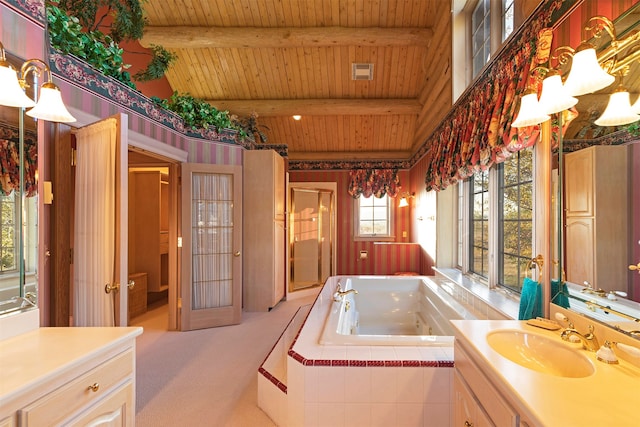 bathroom featuring a relaxing tiled bath, large vanity, wood ceiling, and beamed ceiling