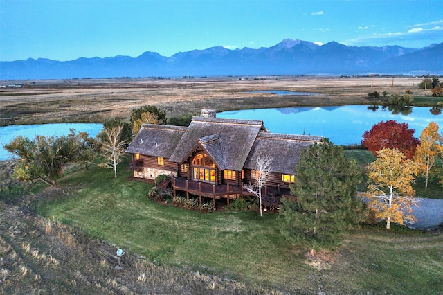 bird's eye view with a water and mountain view