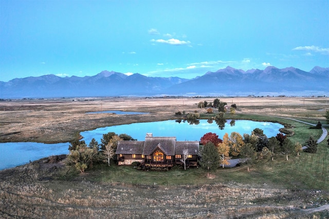 property view of mountains featuring a rural view and a water view