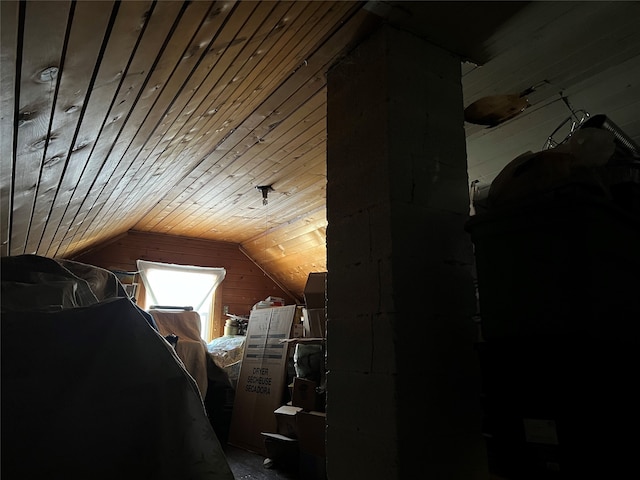 bedroom featuring wood ceiling and lofted ceiling