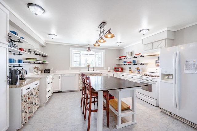 kitchen featuring white cabinetry, crown molding, white appliances, sink, and custom range hood