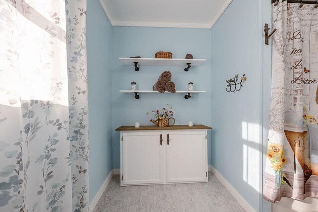 bathroom with vanity and crown molding