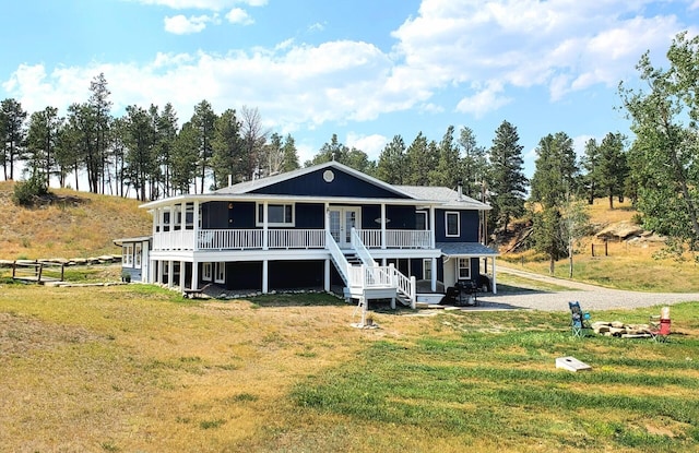 view of front facade with a patio and a front yard