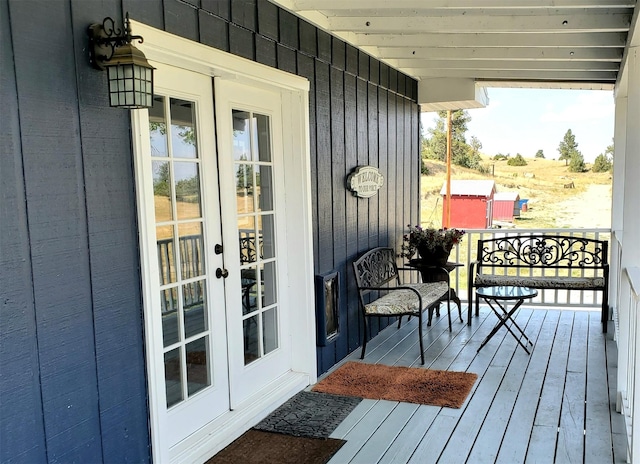 wooden terrace featuring french doors