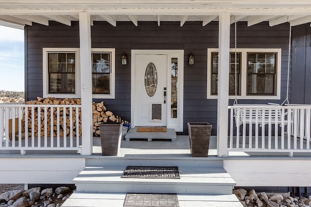 doorway to property with covered porch