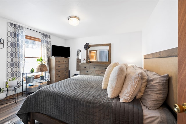 bedroom featuring dark wood-type flooring