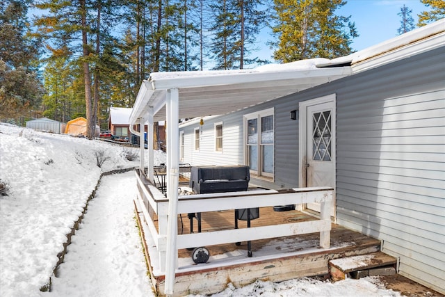 view of snow covered deck