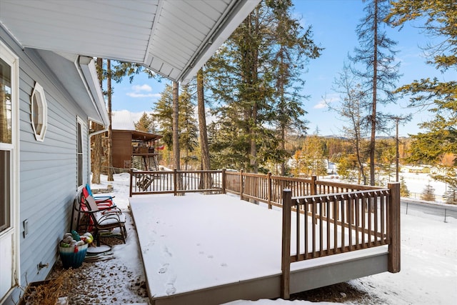 view of snow covered deck