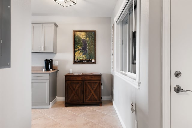 corridor with light tile floors