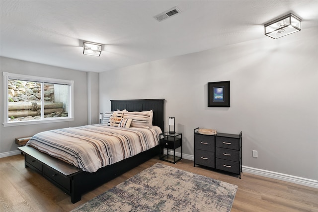 bedroom featuring hardwood / wood-style flooring