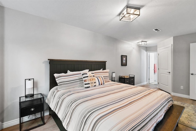 bedroom featuring hardwood / wood-style flooring