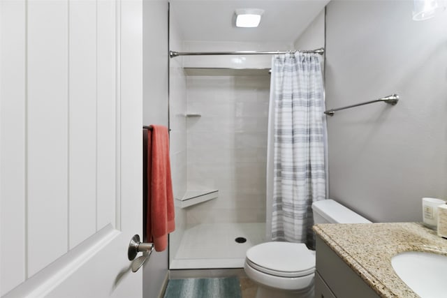 bathroom with vanity, toilet, and a shower with curtain