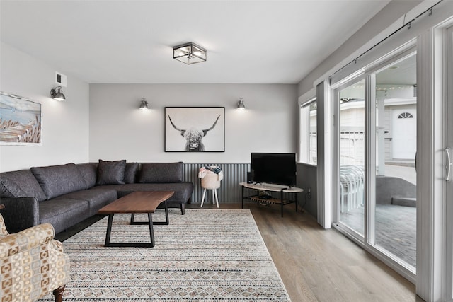 living room with light hardwood / wood-style flooring