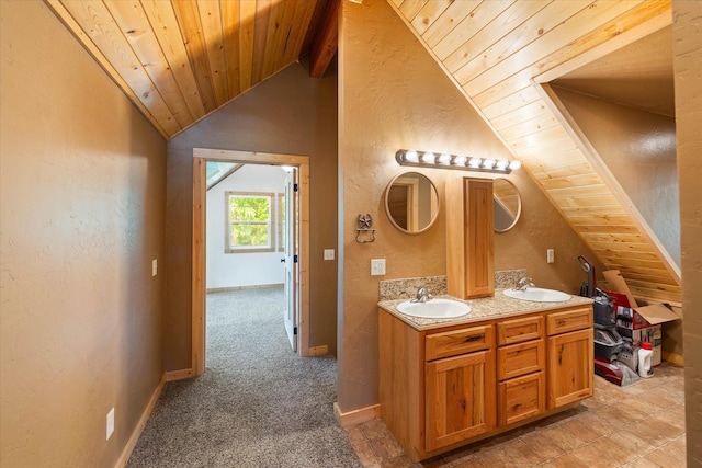 bathroom featuring vanity, lofted ceiling with beams, and wood ceiling