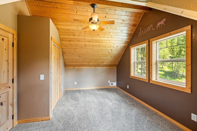 additional living space featuring carpet, ceiling fan, wood ceiling, and vaulted ceiling