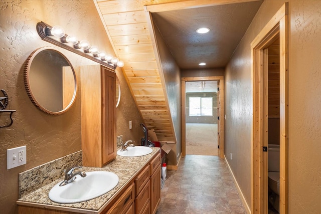 bathroom with vanity, wood ceiling, and toilet