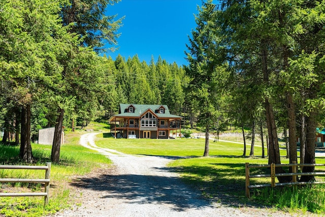 view of home's community with a yard and a deck