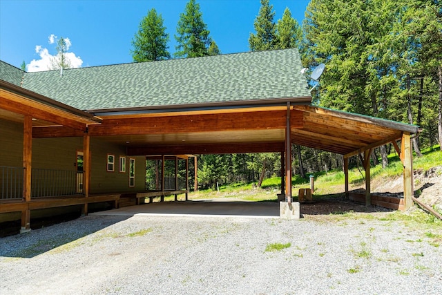 view of vehicle parking with a carport