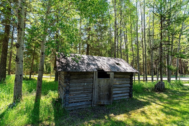 view of outbuilding with a lawn