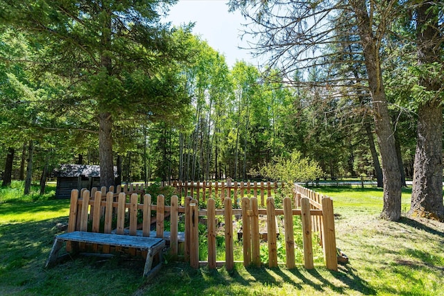 view of property's community with a lawn