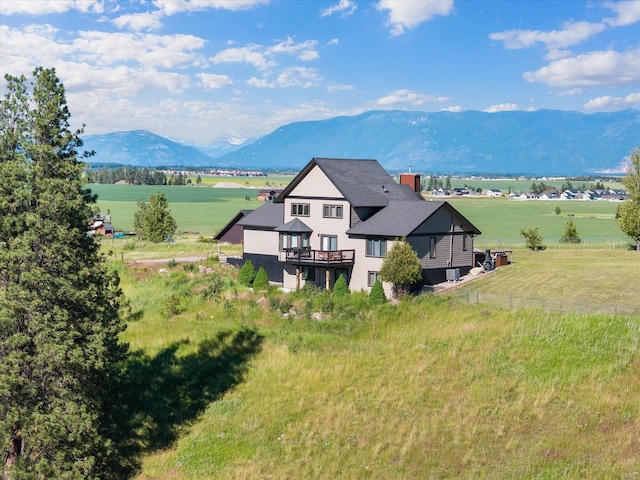 drone / aerial view with a mountain view and a rural view