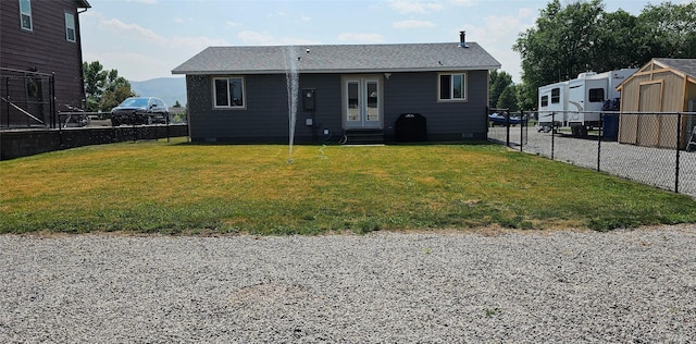 405 S Cherry St, Townsend, MT 59644 - rear view of house featuring entry steps, a fenced backyard, and roof with shingles