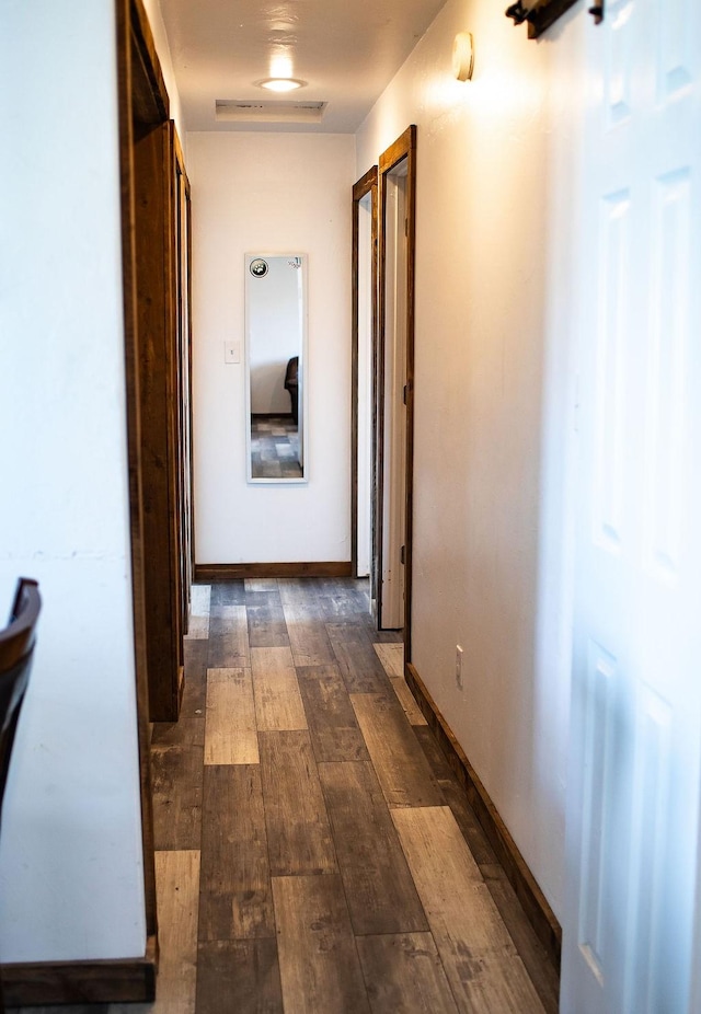405 S Cherry St, Townsend, MT 59644 - corridor with dark wood-style flooring and baseboards
