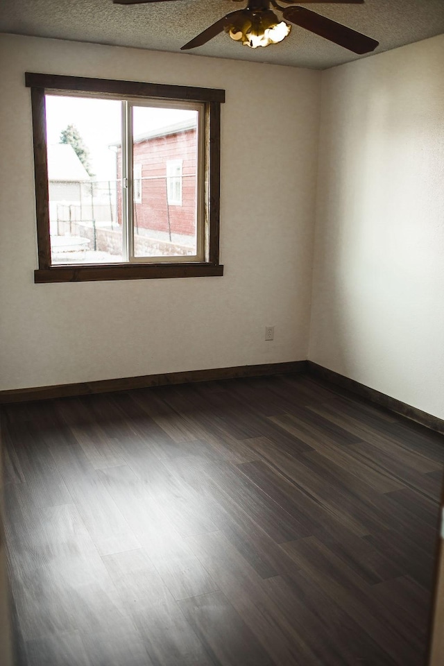 405 S Cherry St, Townsend, MT 59644 - spare room featuring ceiling fan and dark wood-style floors