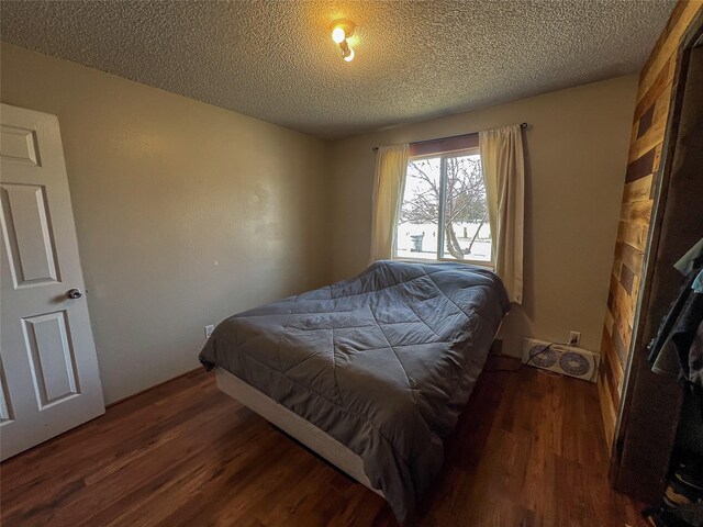 405 S Cherry St, Townsend, MT 59644 - bedroom with wood finished floors and a textured ceiling
