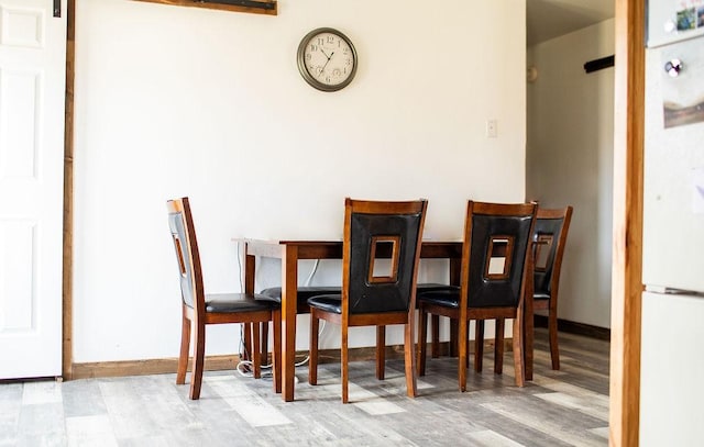 405 S Cherry St, Townsend, MT 59644 - dining area with wood finished floors and baseboards