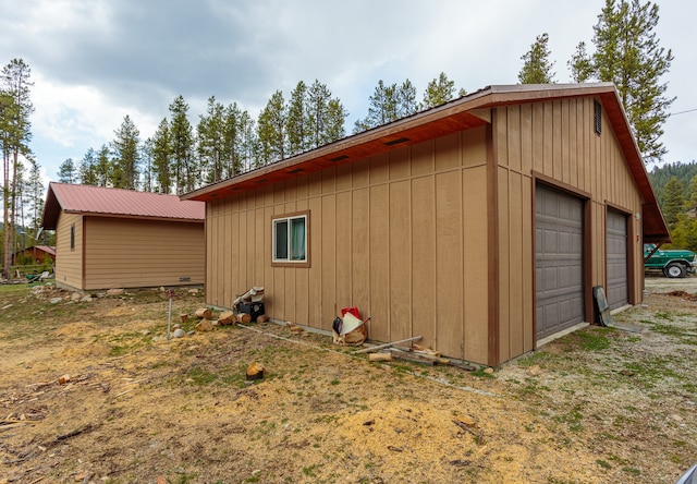 view of outdoor structure with a garage