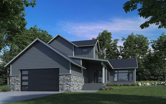 view of front facade with a front yard and a garage