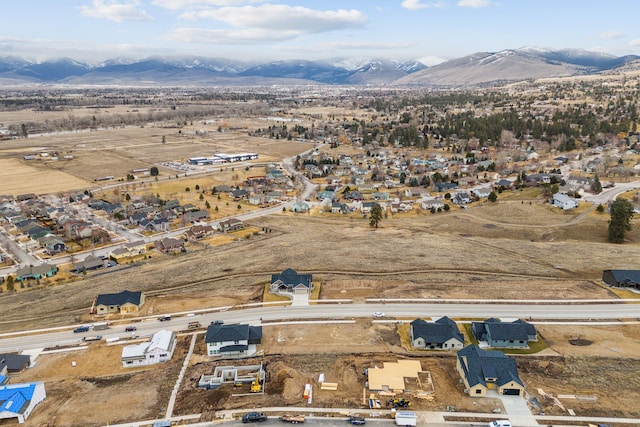 birds eye view of property with a mountain view