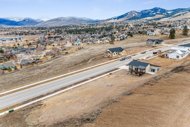 birds eye view of property featuring a mountain view