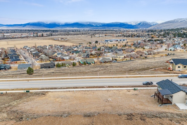 birds eye view of property with a mountain view