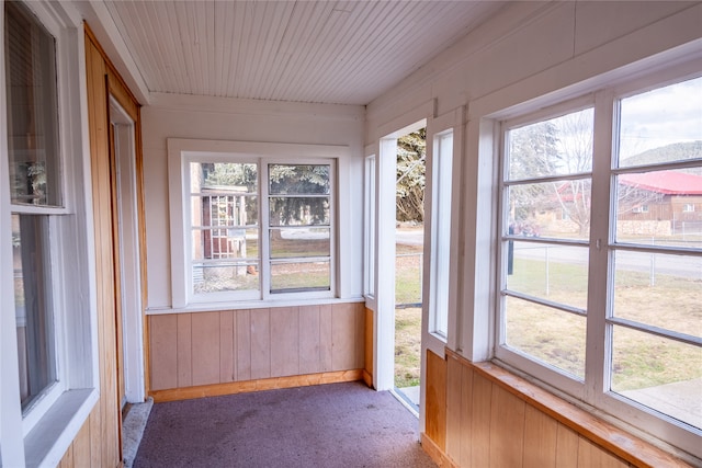 unfurnished sunroom with plenty of natural light