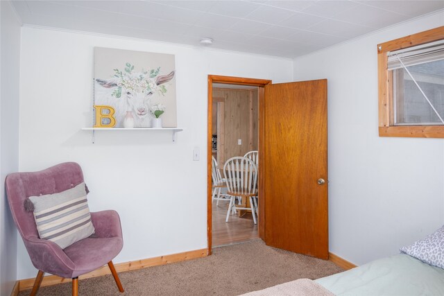 bedroom featuring crown molding and light hardwood / wood-style flooring