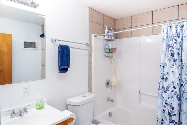 full bathroom featuring shower / bath combo with shower curtain, toilet, and vanity