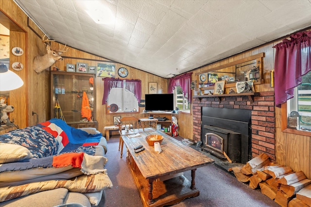 living room with carpet flooring, wood walls, and vaulted ceiling