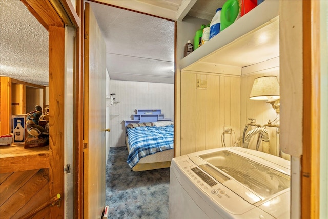 interior space featuring wooden walls and washer and dryer